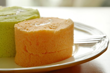 assorted jam roll with fork on plate