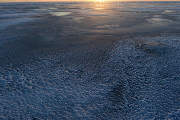 Landscape nature winter ice in the light of the sunset on the Gulf of Finland