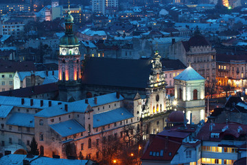 Twilight view of city center from the Tower of Lviv Town Hall. Bernardine church and monastery are among the most popular tourist places.