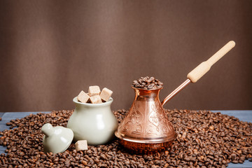 Cooking traditional coffee. Coffee pot with coffee beans.