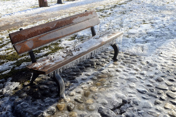Ice, snow and stalactites on a bench