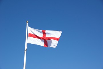 Flag of St George under clear blue sky
