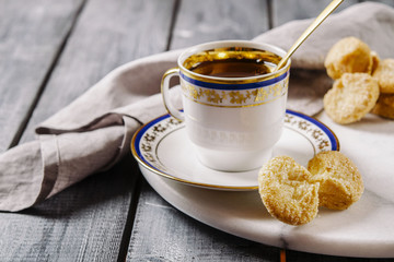 Cup of tea and cookies on a marble tray. Breakfast. Morning. Selective focus. Toned image 