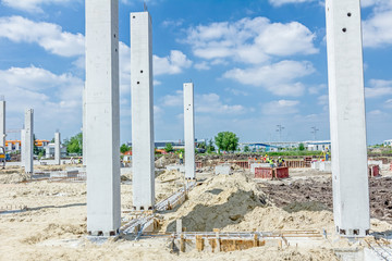 Concrete pillars of new edifice with a beautiful sky are placed