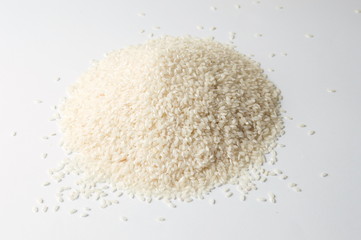 Pile of rice on white background