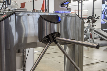 The tripod turnstile with electronic card reader is closed