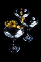 Margarita cocktail alcohol drink in glass with green olives