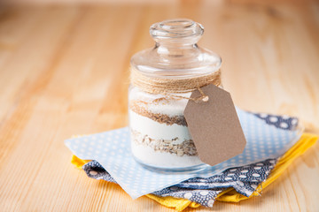 Сookies ingredients in a glass jar. Selective focus. Copy space