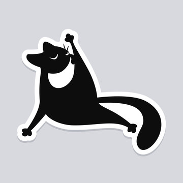 Black cat licking its paw. Wall sticker, decal or decoration