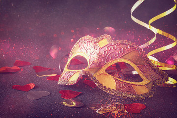 elegant venetian, mardi gras mask on glitter background