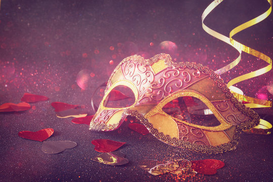 elegant venetian, mardi gras mask on glitter background
