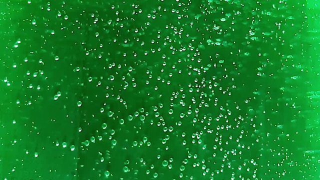 Macro Bubbles Of Water On Green Background
