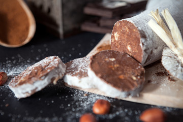 Cut pieces of chocolate salami with hazelnuts