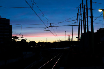 Fototapeta na wymiar Train station silhouette at dusk