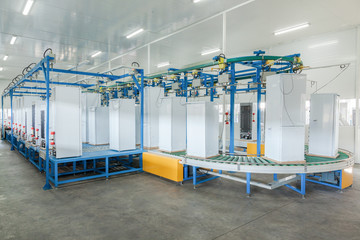 at the factory final inspection  of refrigerators on the conveyor belt