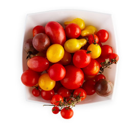 Yellow pea, cherry and plum tomato sorts isolated on white