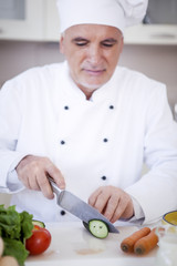 Chef Cutting a Cucumber