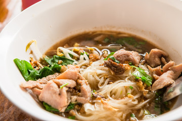 bowl of noodles with pork slices