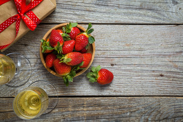 Valentine's day concept - champagne, strawberry and present