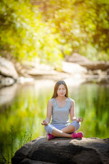 asian woman practice Yoga - relax in nature