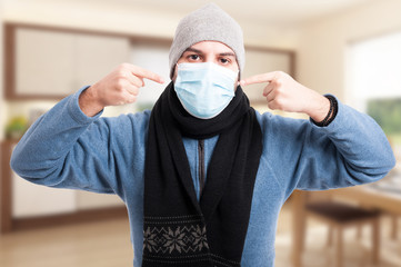 Man with flu wearing a face mask