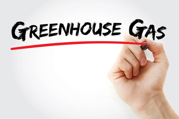 Hand writing Greenhouse gas with marker, concept background