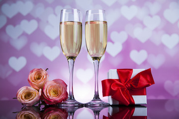 Champagne with Valentines day background and roses, mirror backg