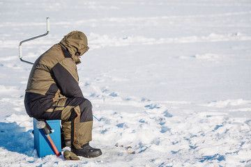 Winter fishing on lake.