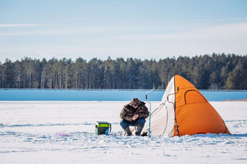 Winter fishing on lake.