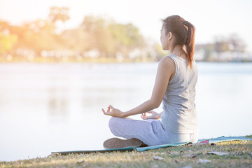 Fototapeta premium asian woman practice Yoga - relax in nature