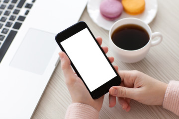 Women hands holding phone isolated screen with coffee and laptop