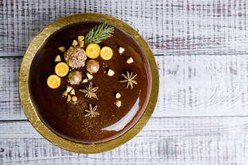 mirror glaze Christmas mousse cake with anise and kumquat