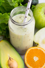 smoothies, avocado, apple and orange - top view