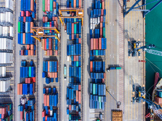 Aerial Top view of Industrial Shipping Port with Stacking Contai