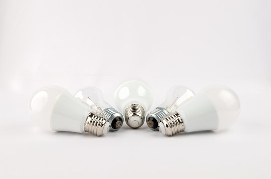 several LED energy saving light bulbs over the old incandescent, use of economical and environmentally friendly light bulb concept