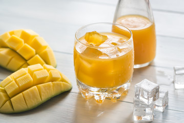 Mango juice on the wooden table