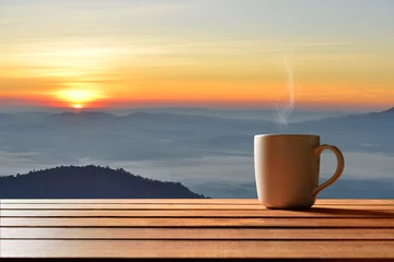 Foto auf Acrylglas Morning cup of coffee or tea with mountain background at sunrise © amenic181