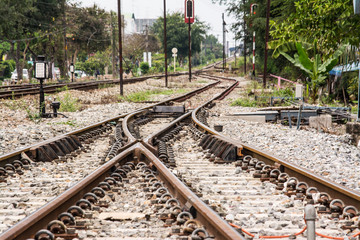 Fototapeta na wymiar The track on a railway or railroad is the structure consisting of the rails, fasteners, railroad ties and ballast, plus the underlying subgrade.