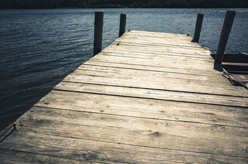 Empty wooden pier, vintage toned