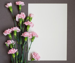 Card with fresh flowers carnation