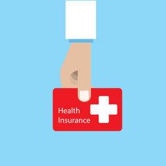 Doctor holding health insurance card