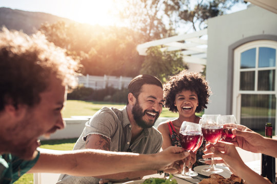 Friends enjoying a outdoor party with drinks