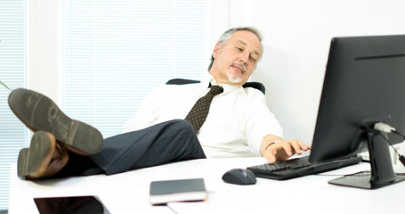 Businessman relaxing in his office