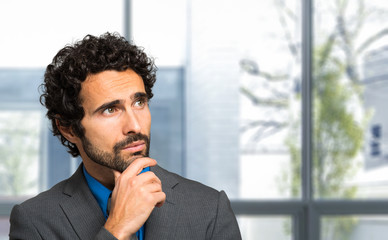 Portrait of a thoughtful handsome businessman