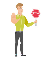 Fototapeta na wymiar Caucasian businessman holding stop road sign.