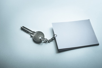 Key concept with blank paper note