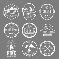 Set of vintage and modern bike shop logo badges and labels.