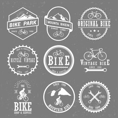 Set of vintage and modern bike shop logo badges and labels.