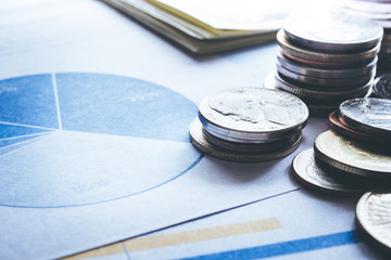 Coin money stacked growing on document graph.financial