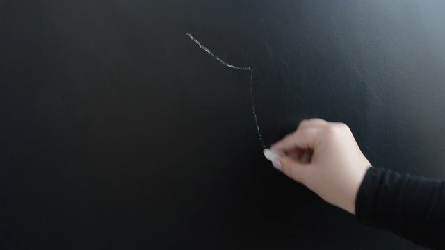 We draw chalk a dog on a board.